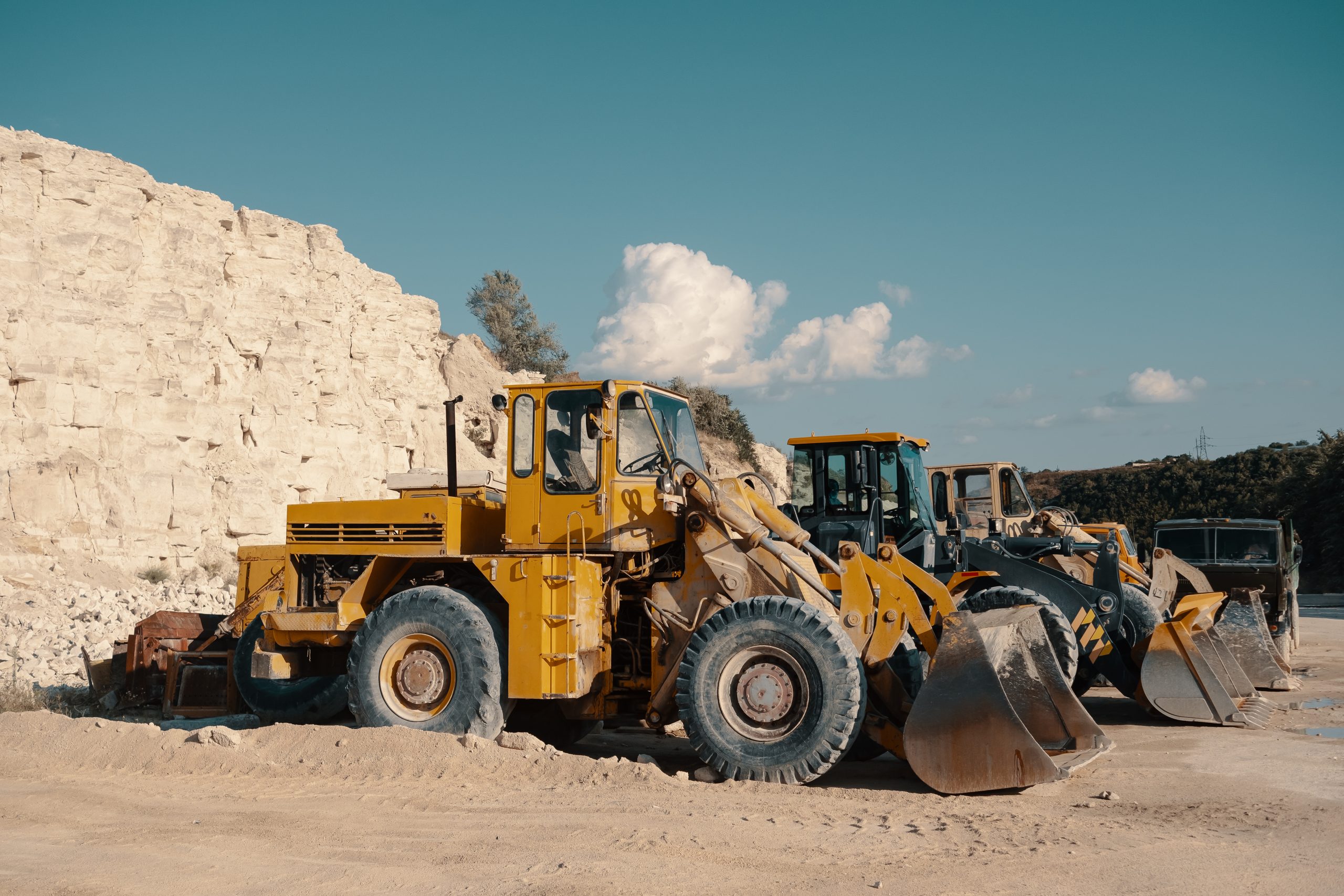 Heavy machinery in quarry. Building materials mining